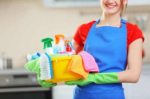 Carpet cleaning team preparing equipment with safety focus