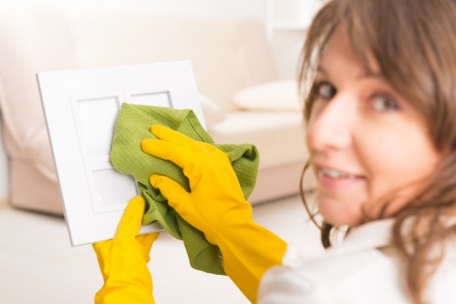 Staff member using protective equipment during cleaning